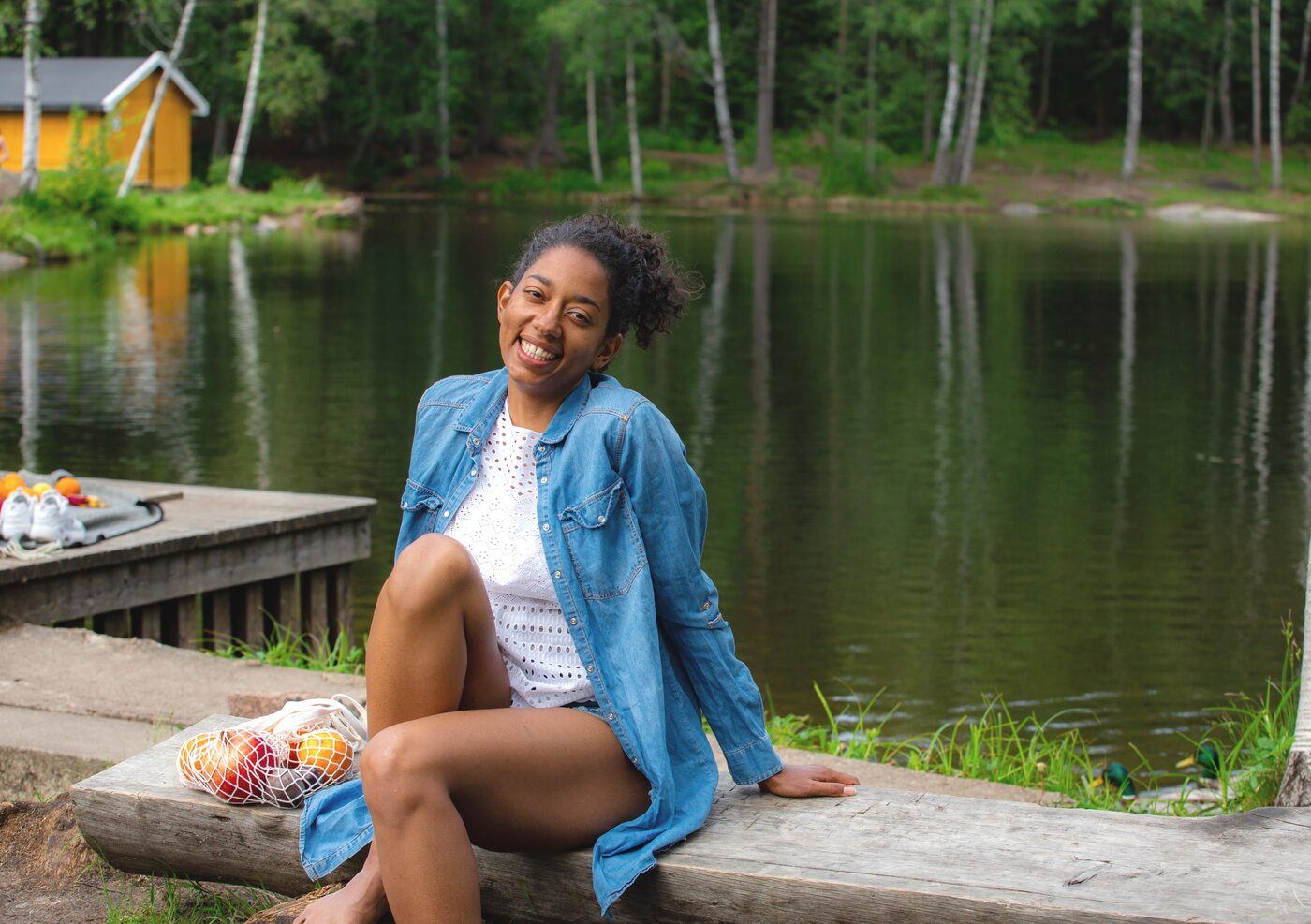Telma Fjelltveit sitting by a lake in Norway